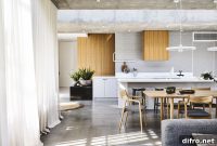 Dramatic Kew Home with White Aluminum Screen and Poured Concrete