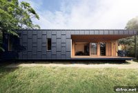 Warm Plywood Meets Dark Metal in This Affordable Australian Home