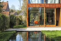Contemporary Concrete, Steel and Glass Home Wrapped in Greenery