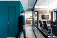 Green Bathroom Adds Vibrant Color to Modern Office