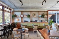Australian Restaurant Interior: Exposed Concrete and Earthy Green