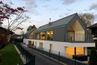 Gray Gabled Roof Transforms Two-Unit Home Facade