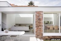 Minimalist White Extension Revitalizes Aging Suburban Home