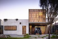 Hardwood and Concrete Suburban Home Opens to Wetlands