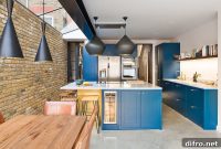 Navy Blue and Brass Revitalize a Traditional Shaker Kitchen