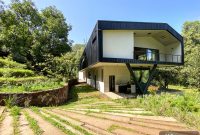 Ocoxal Eco House: Modern Forest Home with Clean Energy
