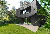 Curved Design Meets Swiss Box in Modern Wooden House