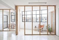 Custom Wood and Glass Walls Transform Smart Barcelona Studio