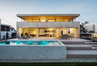 Light-Filled Two-Story Wooden Home with Spacious Deck and Pool