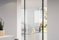 10 Pivot Door Designs That Bring Drama and Style to Your Home