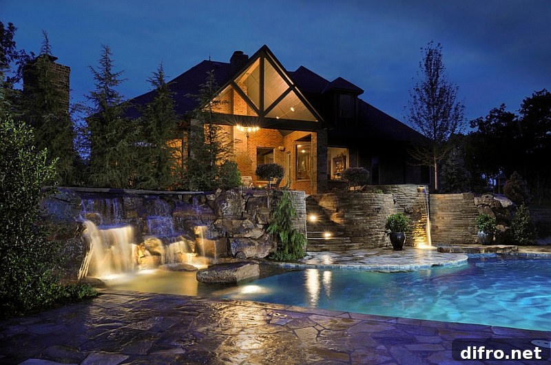 Elaborate swimming pool with multi-level waterfalls and patios