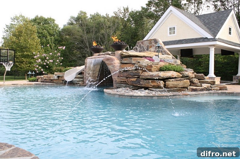 Expansive pool with a water slide, waterfall feature and water jets!