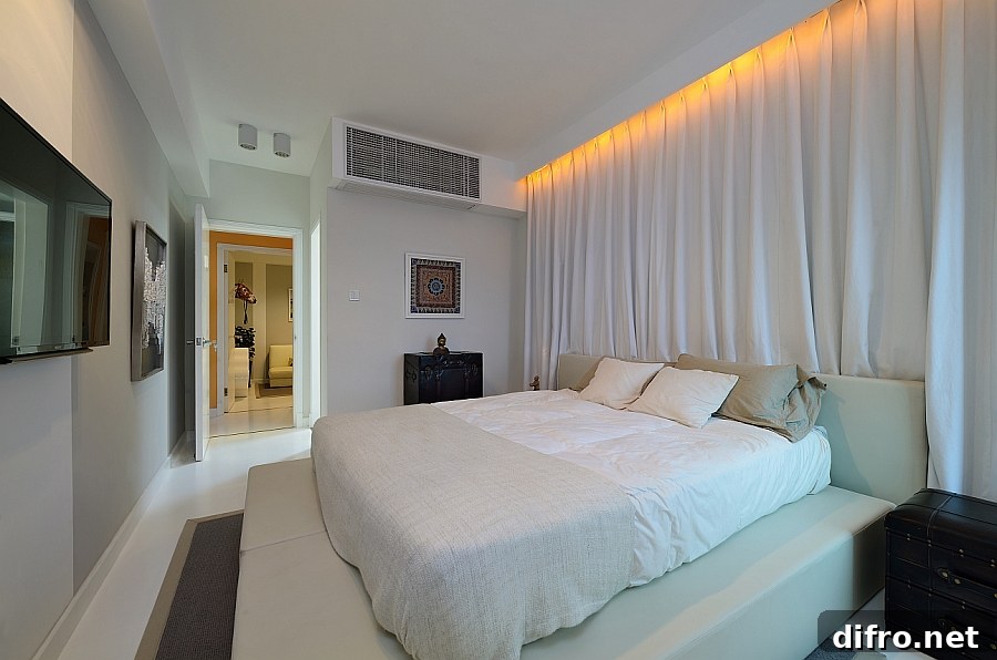 Cozy bedroom inside the Shanghai apartment in trendy white