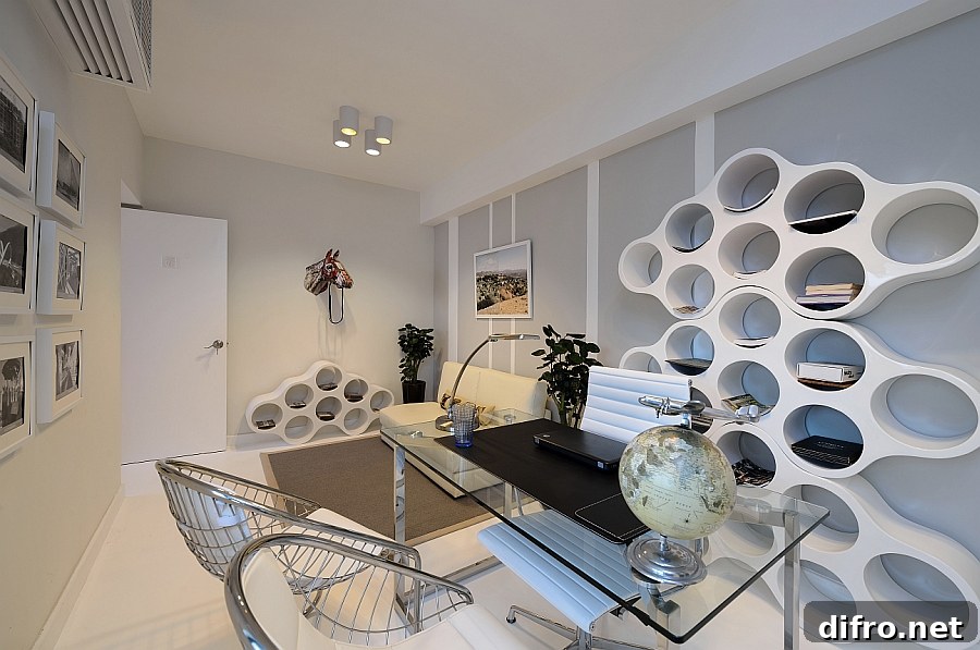 Fabulous home studio with a custom designed bookshelf that adds geometric pattern