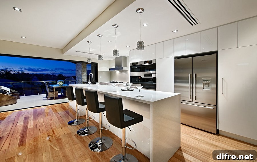 Spacious kitchen in white with a lovely island and smart seating
