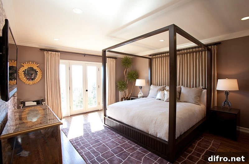 A touch of greenery in the corner adds to the Hollywood appeal of the bedroom