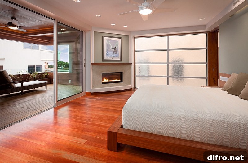 Sleek corner fireplace adds elegance to the serene bedroom