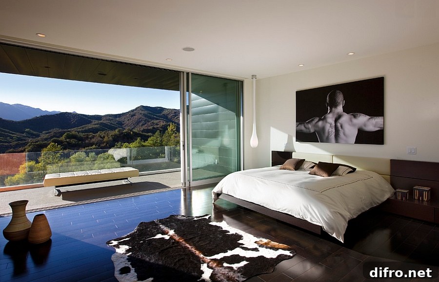 Stunning view outside instantly elevates the appeal of this gorgeous bedroom with a masculine style