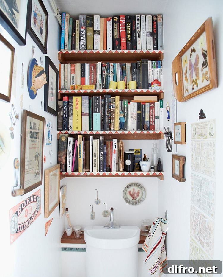 Shelves of the eclectic powder room are decked out with books [Design: Joanna Thornhill Interiors]