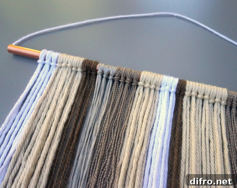 Yarn wall hanging in neutral tones