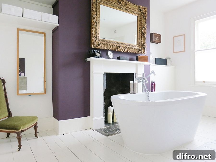 Exquisite eclectic bathroom with a purple accent wall [Design: Mad About Your House]