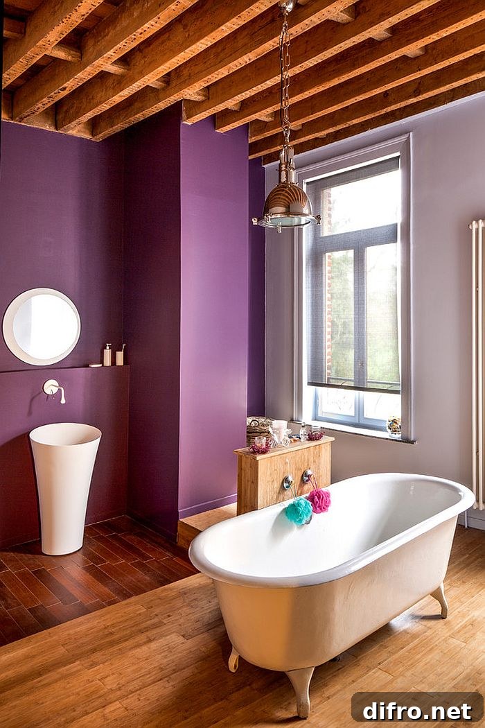 Wood adds visual warmth to the brilliant contemporary bathroom [Photography: studio vdm]
