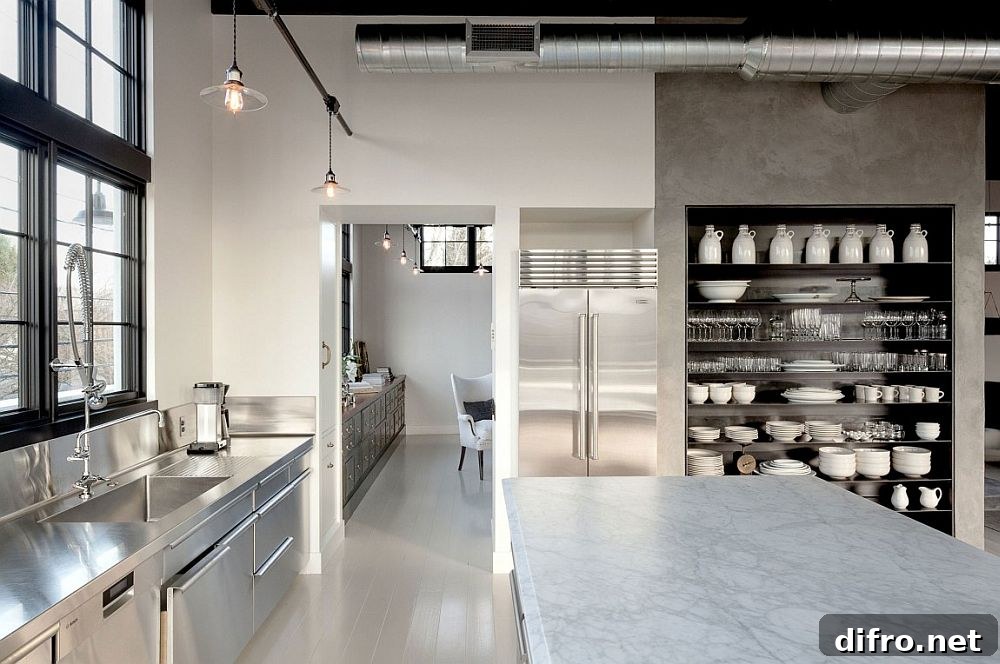 Concrete, steel and glass shape the large kitchen of the house