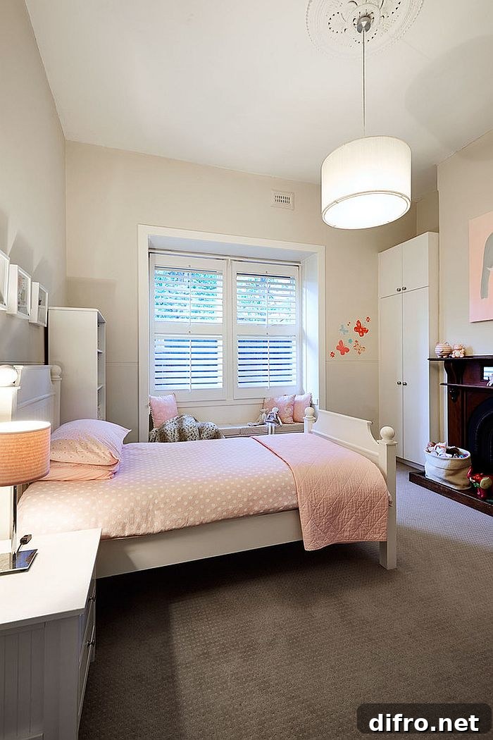 Lovely use of soft pink in the traditional bedroom