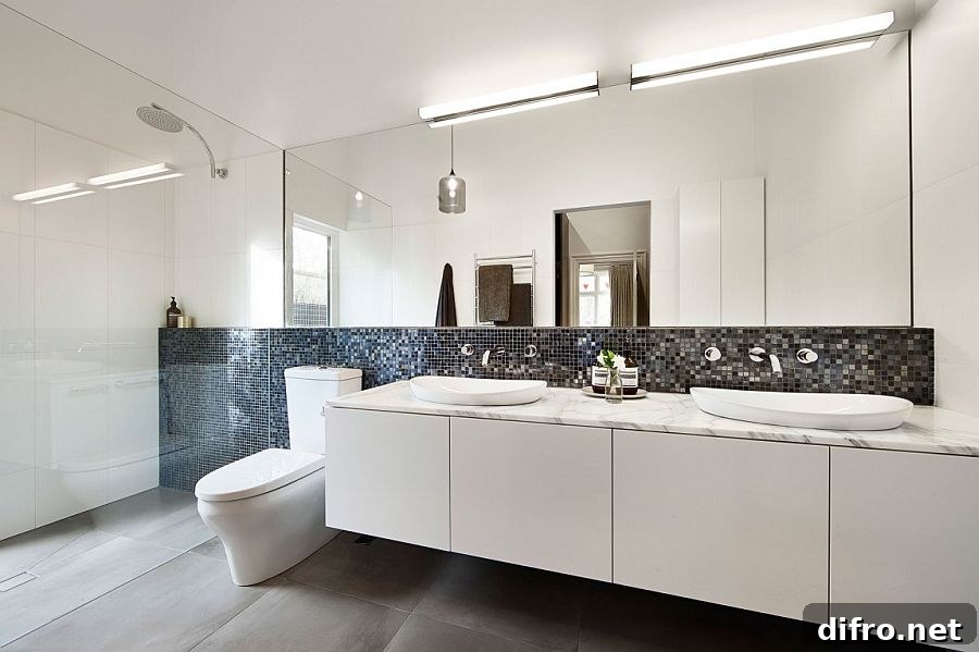 White bathroom vanity with a marble top