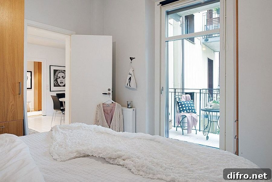 Elegant bedroom with a small balcony and minimalist design
