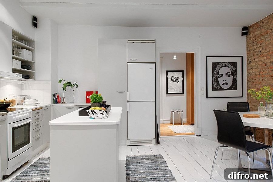 Sleek shelves and smart kitchen island shape the Scandinavian kitchen