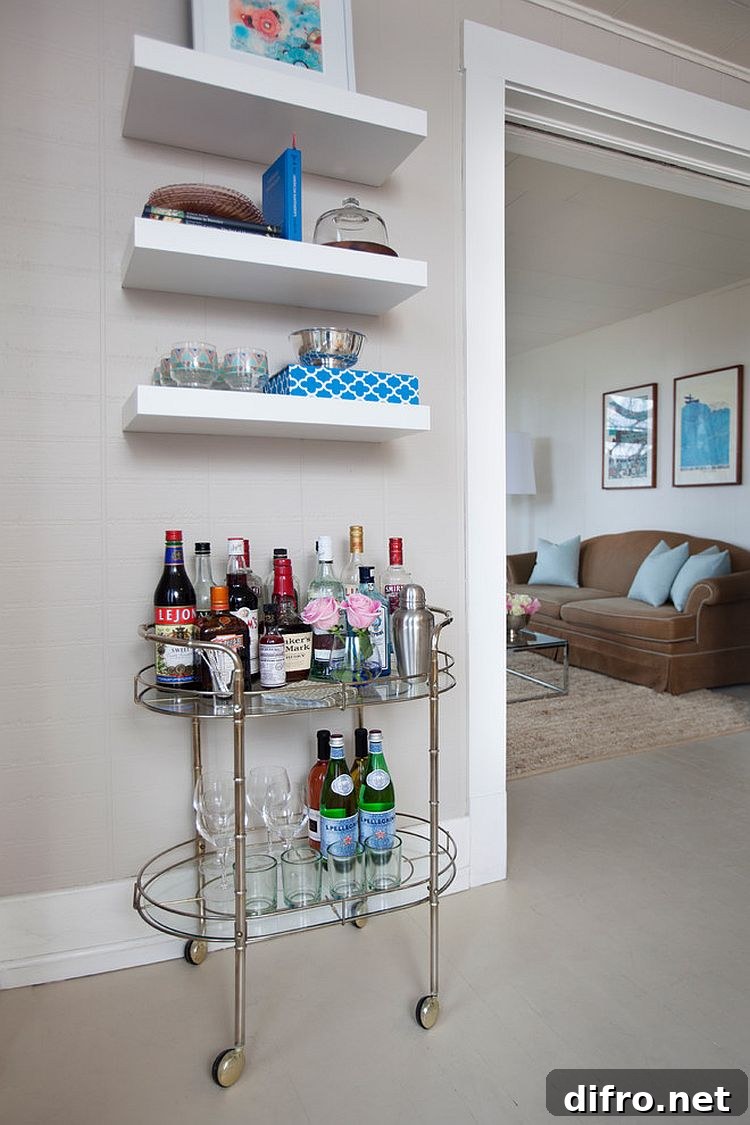 A vintage bar cart and a few floating shelves is all you need for a tiny home bar [Design: Maggie Stephens Interiors]