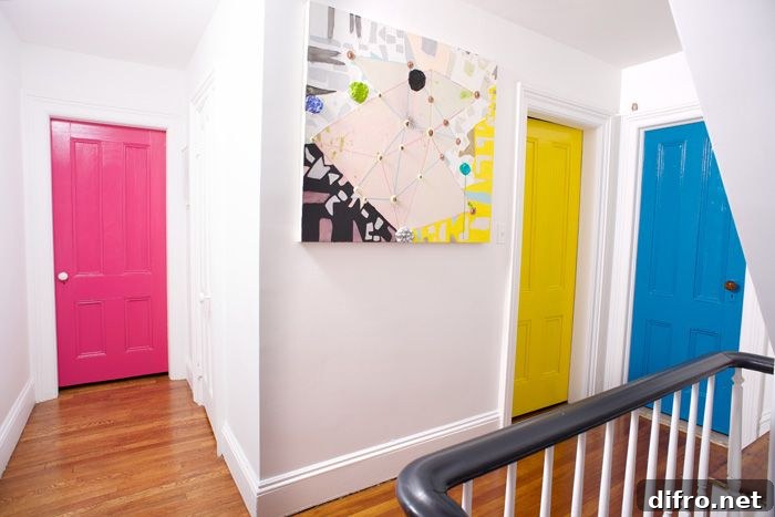 Brightly painted doors stand out against white walls