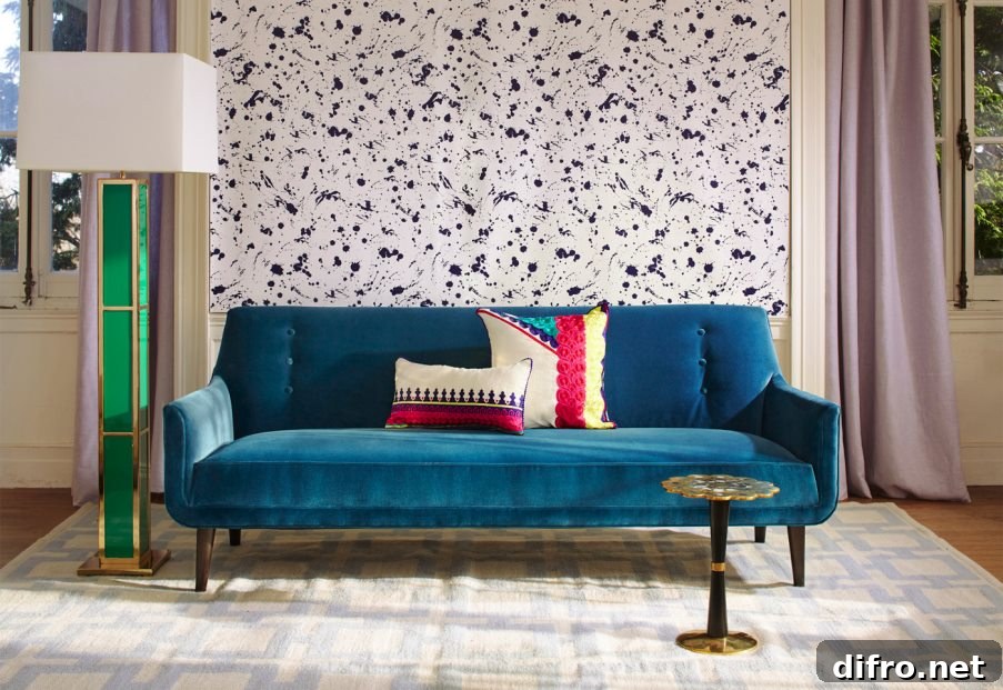 Peacock blue sofa from Jonathan Adler