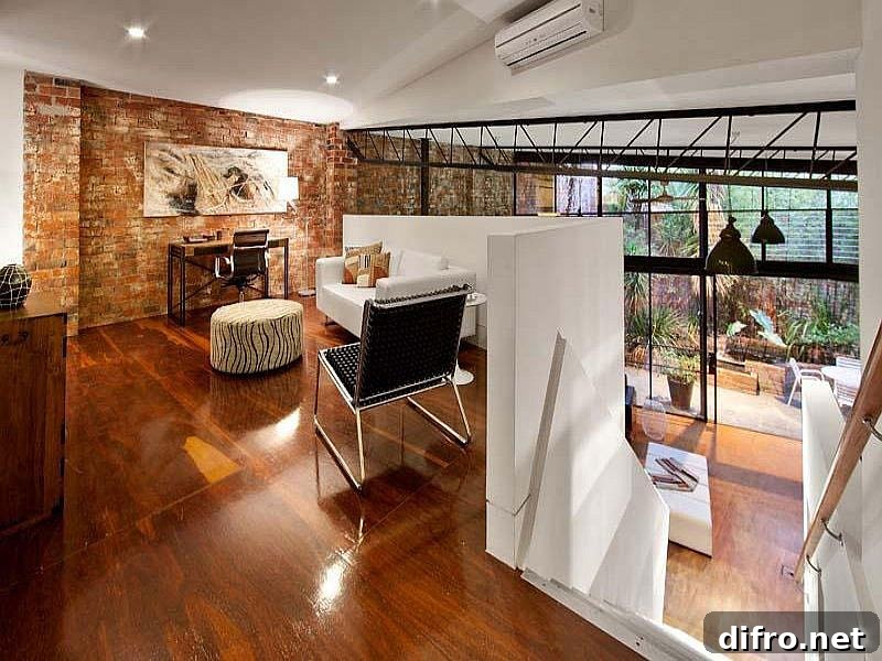 Home office on the newly added top level overlooking the living area below