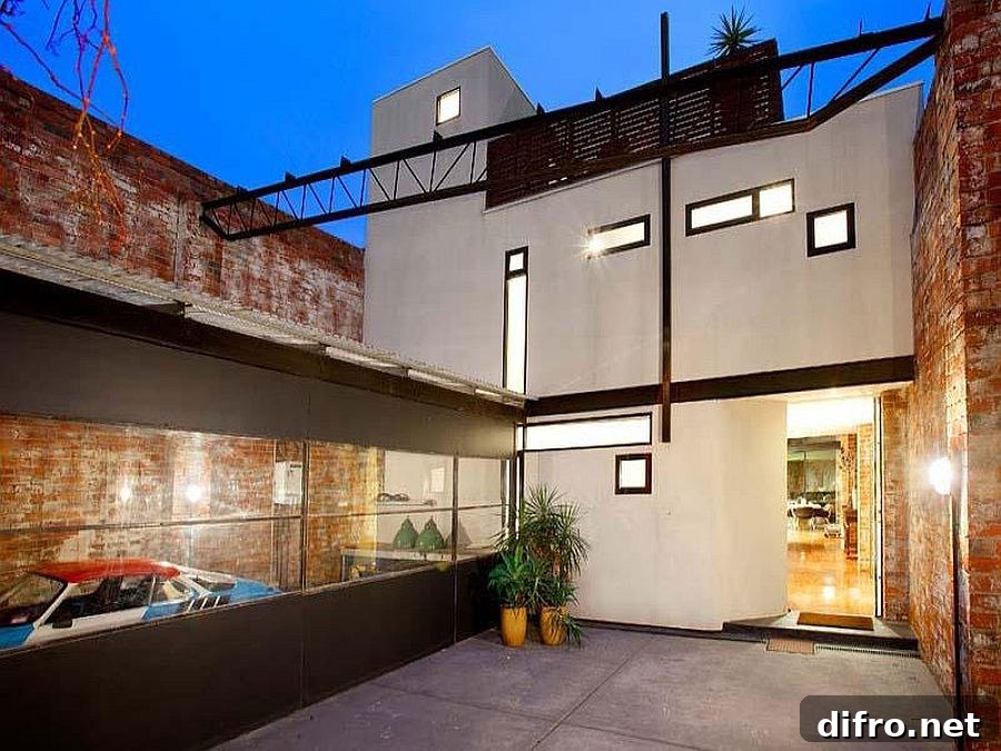 Exterior of the warehouse residence preserves the original character of the brick wall building