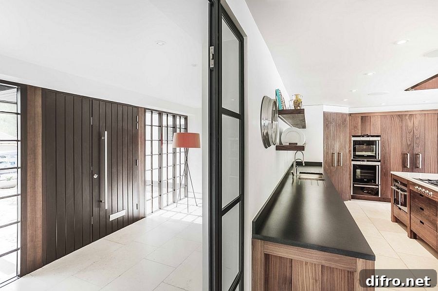 Kitchen and loggia of the revamped Surrey home with lovely wooden elements