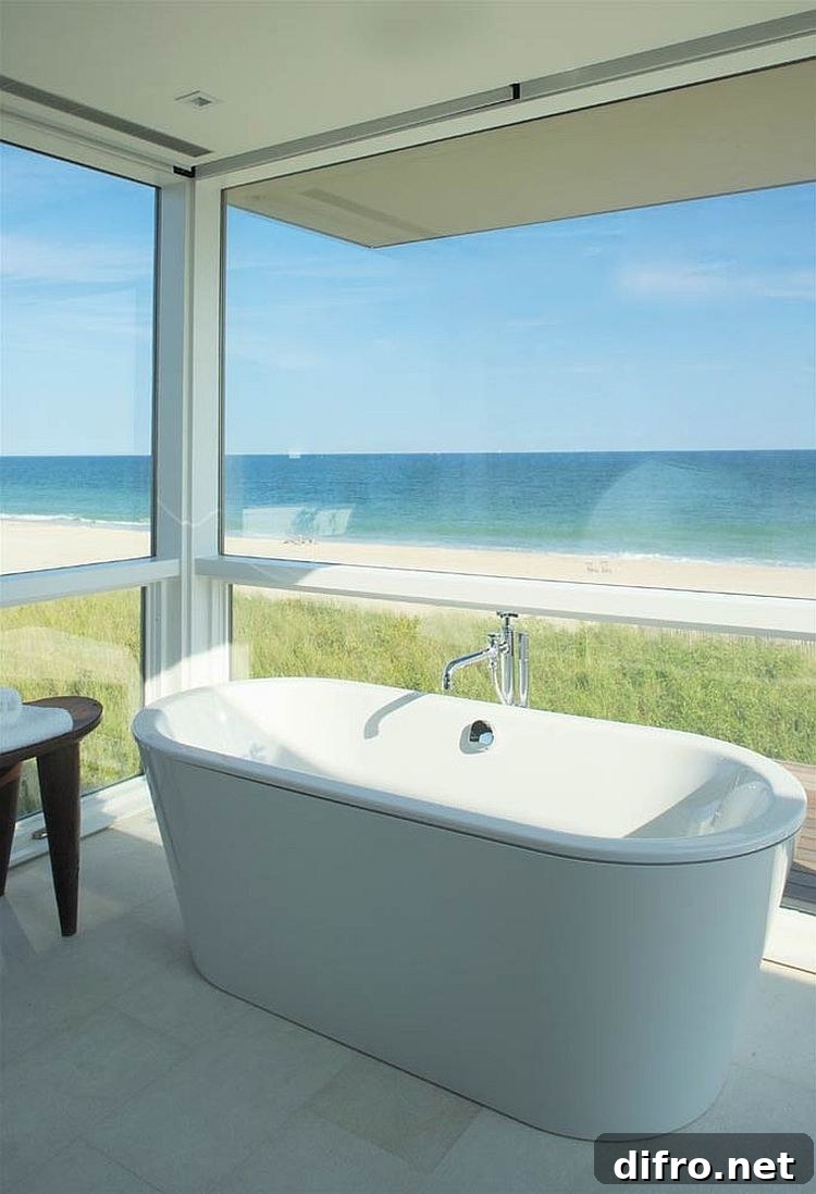 Revamped beachfront home with a bathroom that opens to the view outside [Design: Stelle Lomont Rouhani Architects]