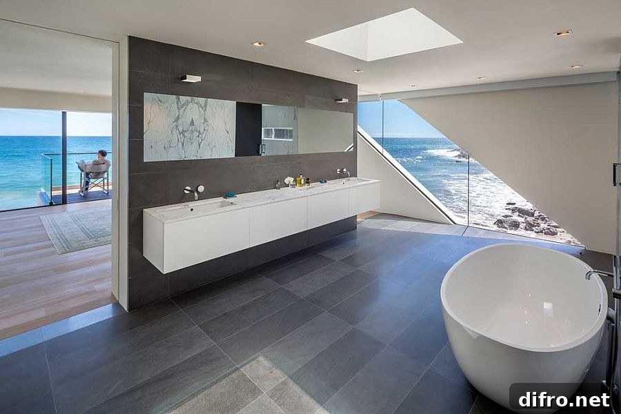 Master bathroom seamlessly connected with the bedroom and the view outside [Design: Mark Dziewulski Architect]