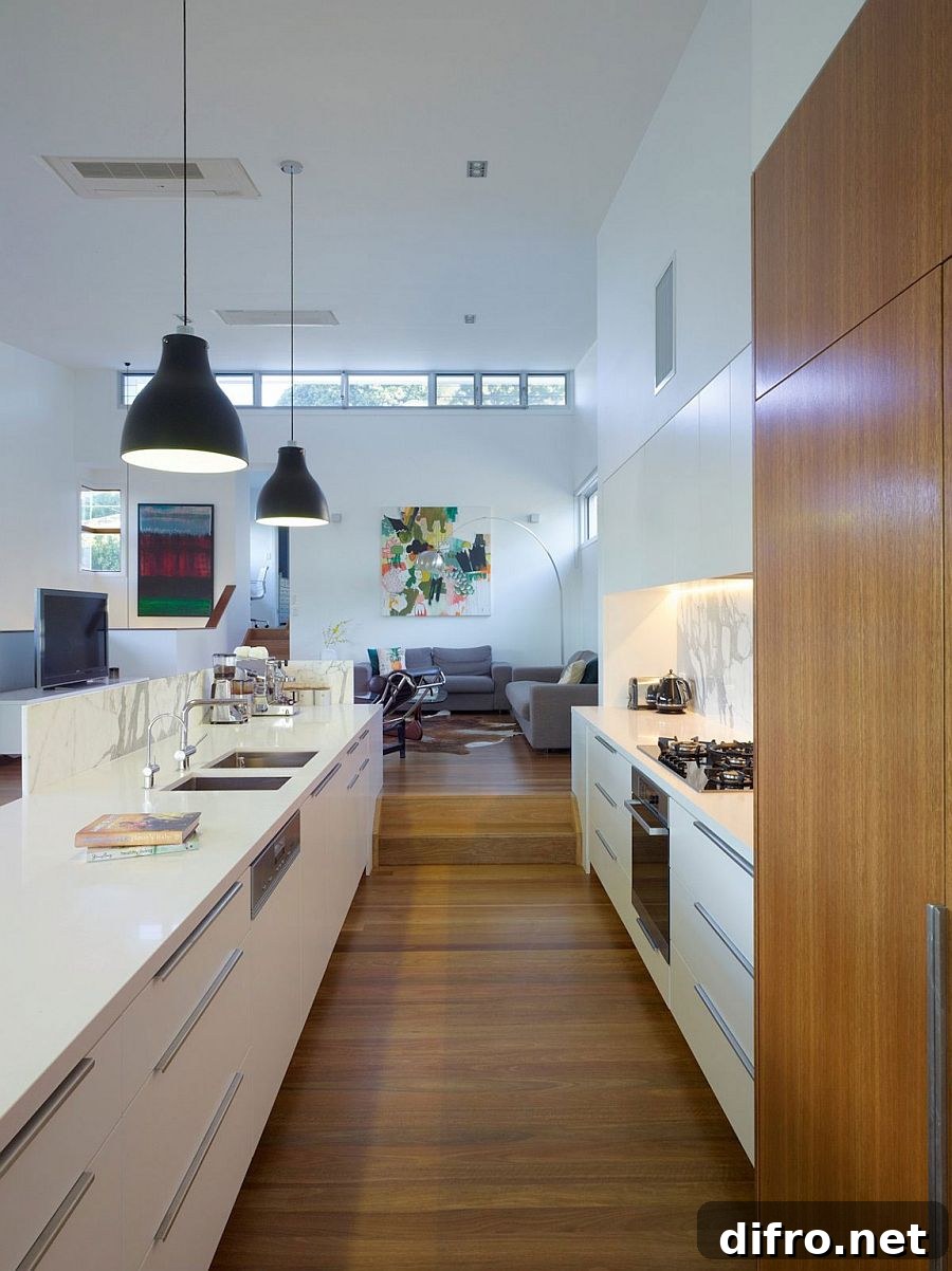 Kitchen in white with marble and stone finishes and wooden shelves