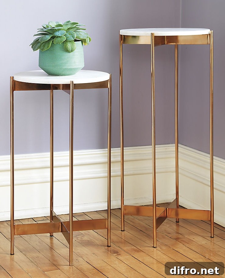 Rose gold pedestal tables from CB2