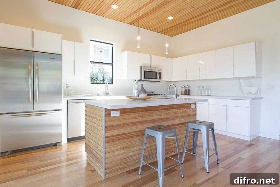 Stylish kitchen in white with a smart central island and breakfast counter