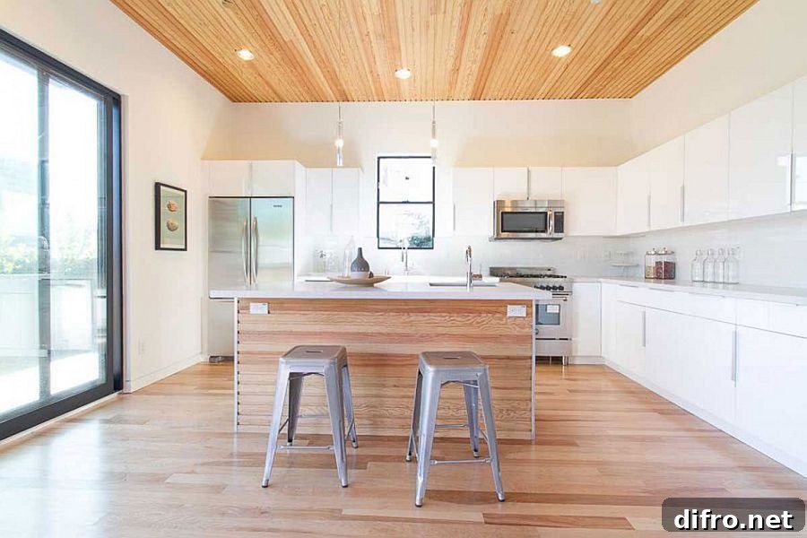 Contemporary kitchen in white with a wooden ceiling