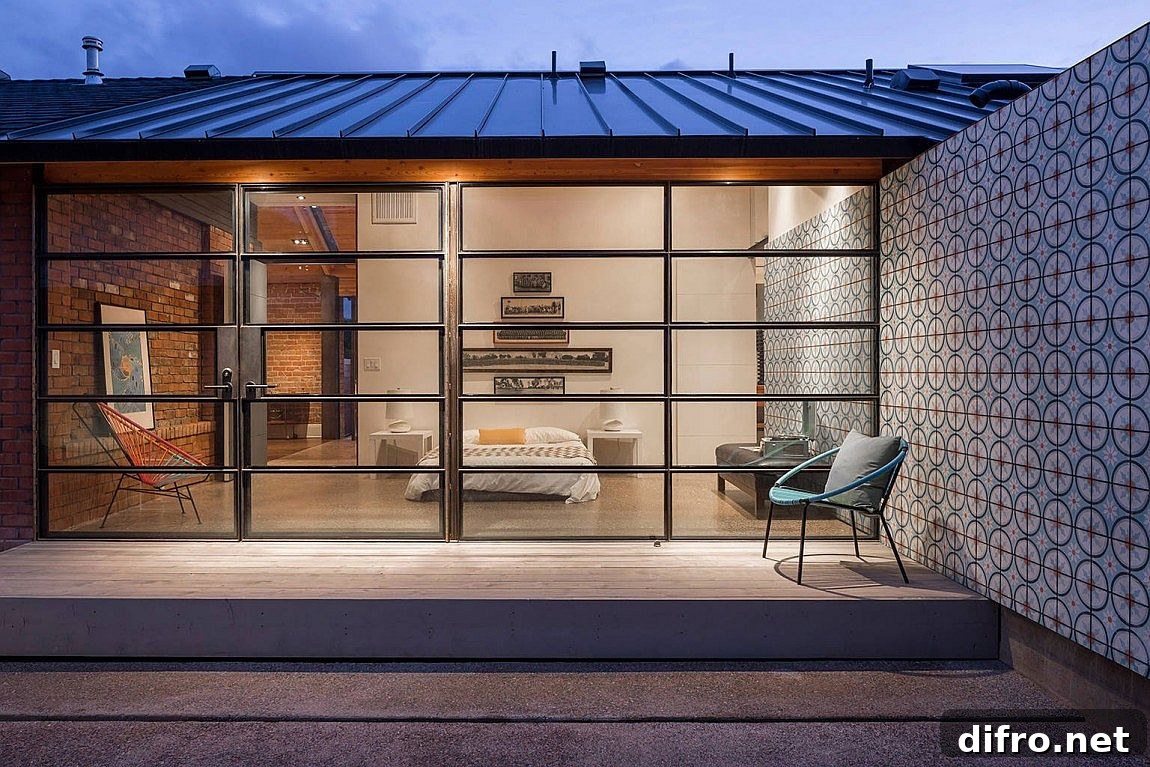 Wall of glass connects the bedroom with backyard