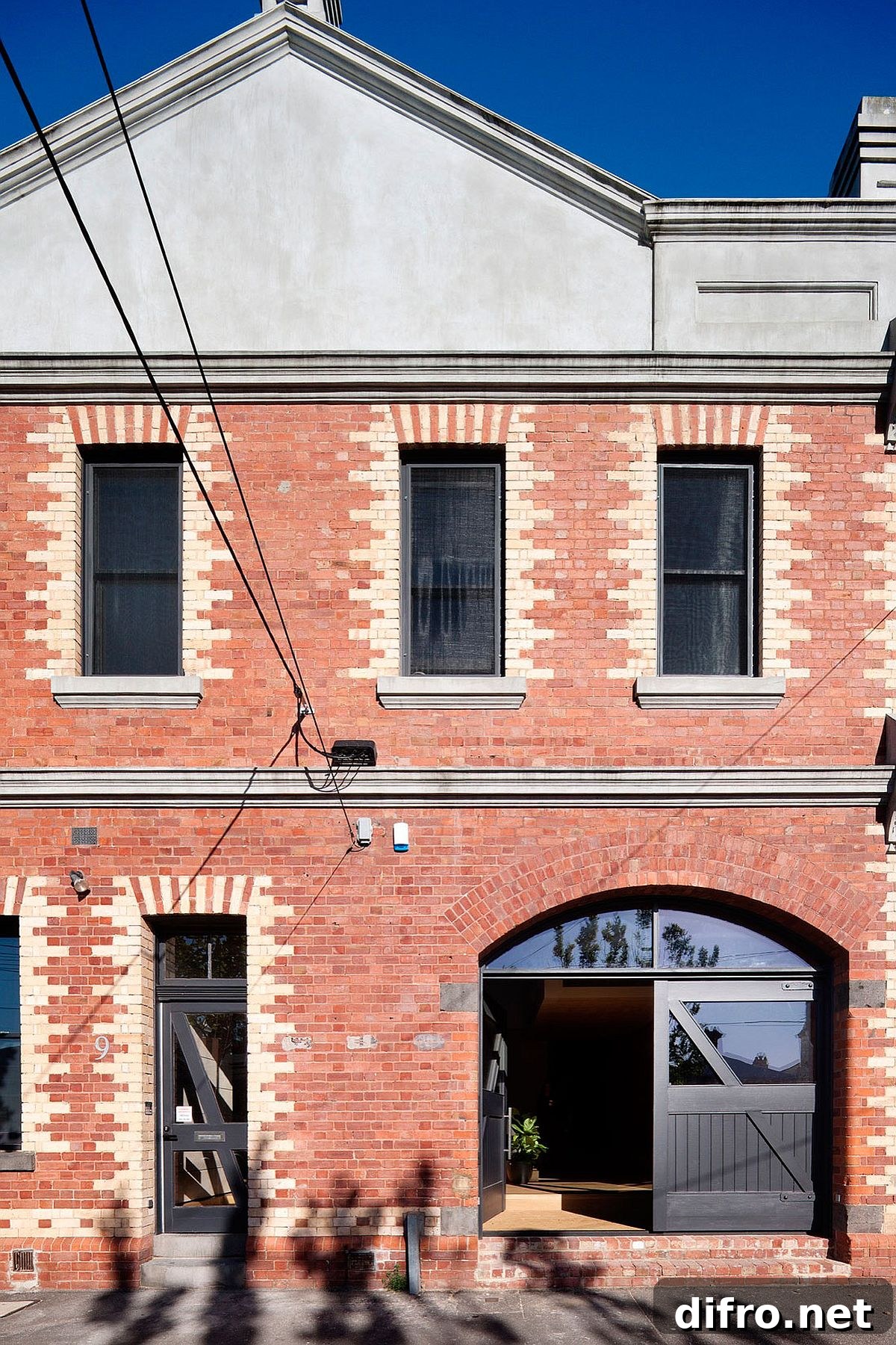 Heritage exterior of 19th century industrial warehouse turned into modern home in North Fitzroy