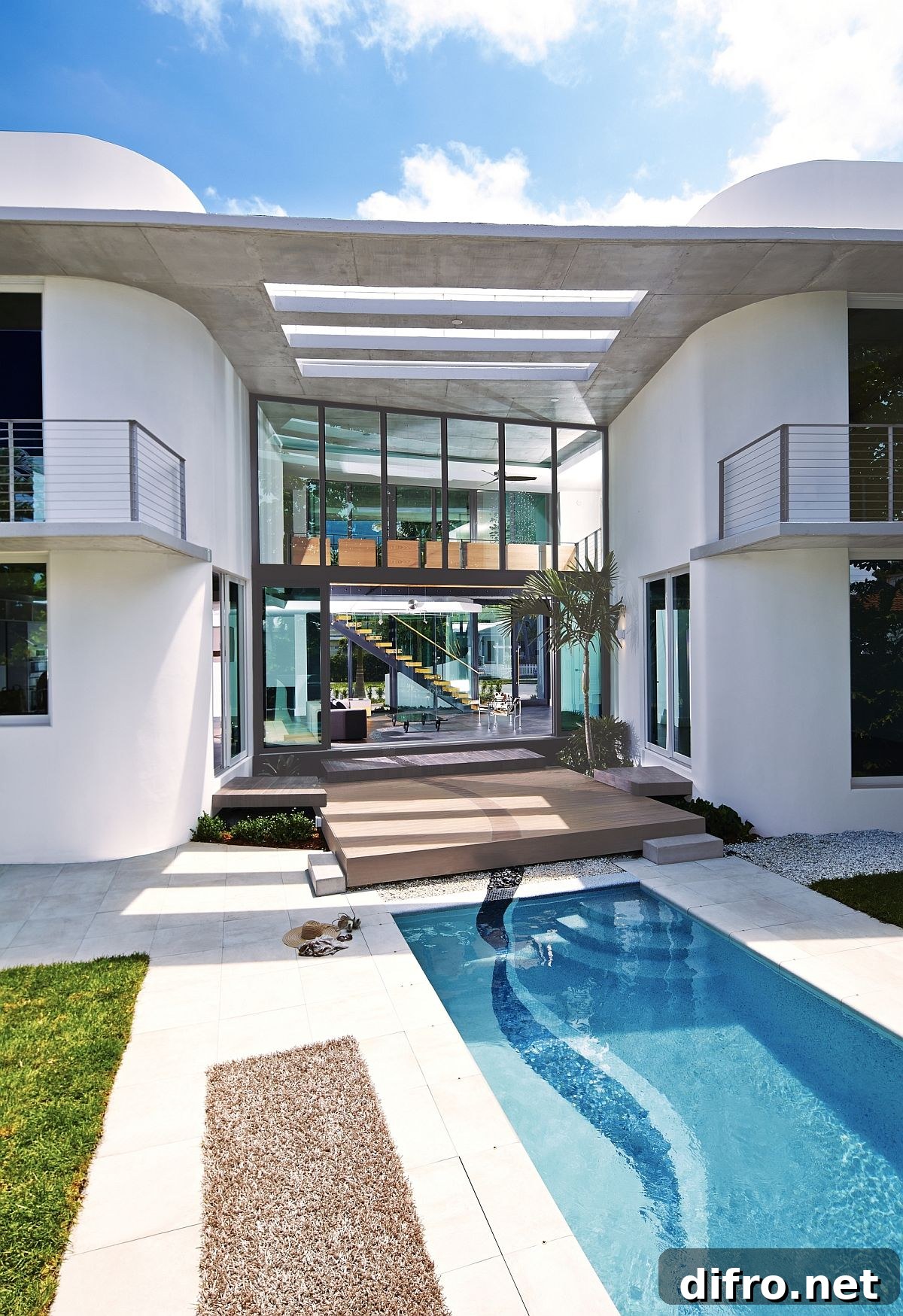 Miami's unique culture, MIMO style and heritage shape the contemporary residence with expansive backyard