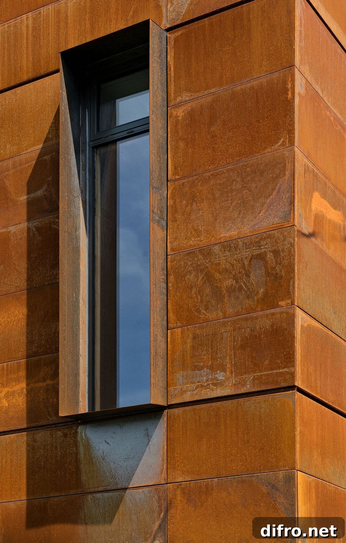 Weathered Cor-Ten steel facade adds color and unique character to the contemporary home