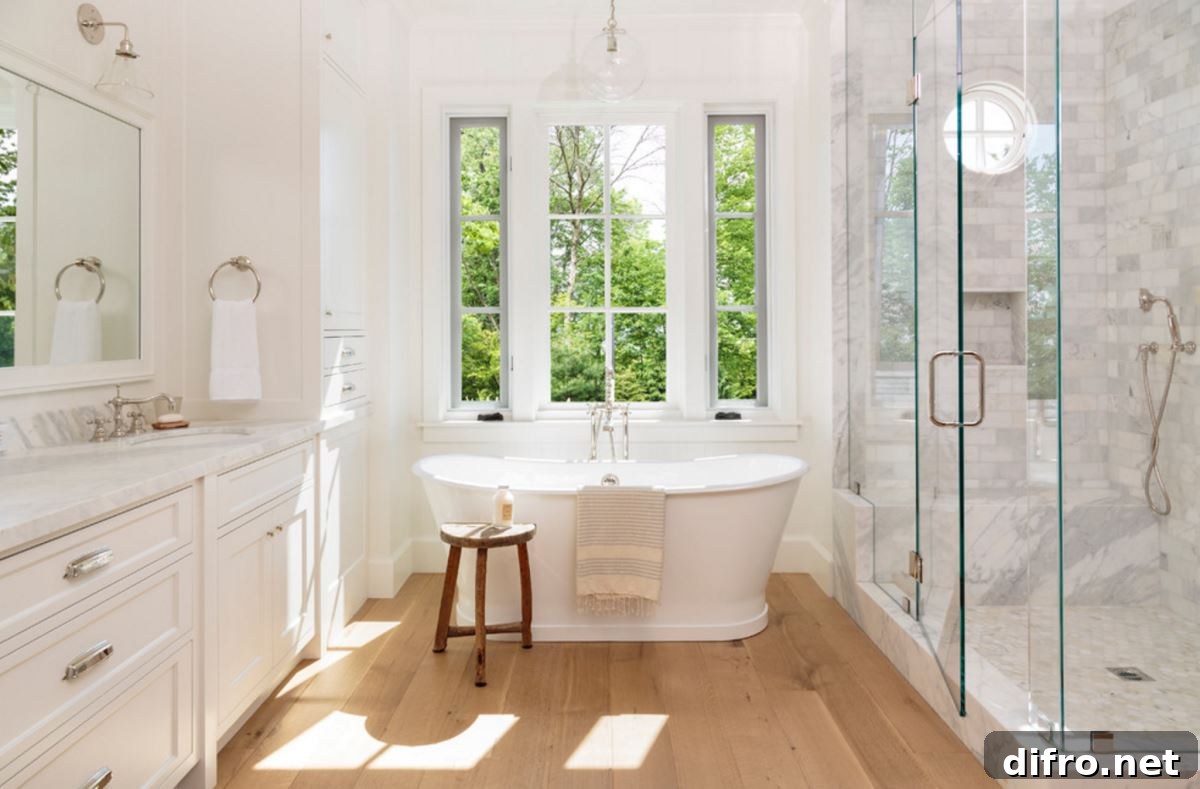 Light-filled bathroom with a wooden stool