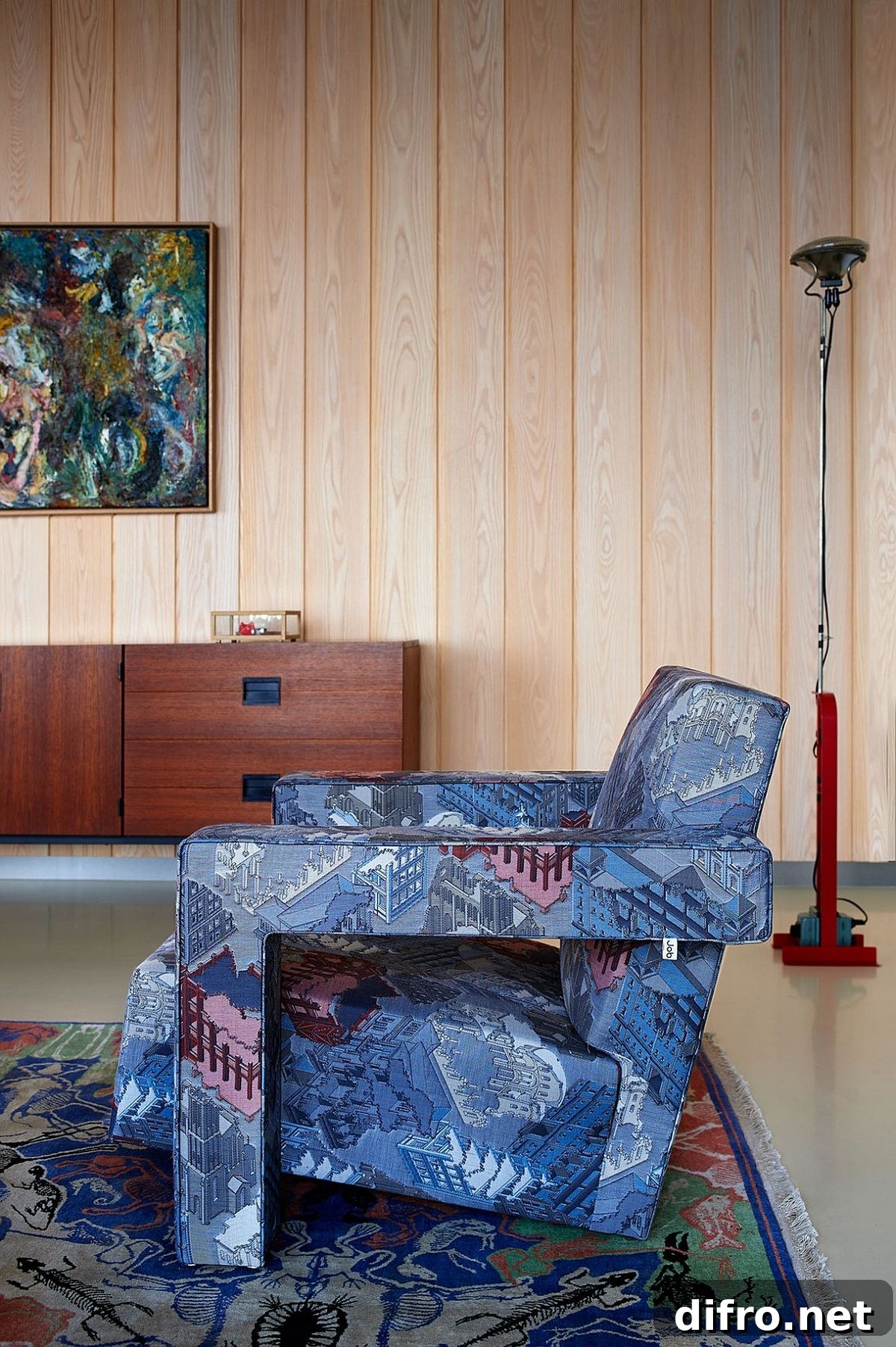 Fabulous and colorful armchair seems like an extension of the vibrant rug