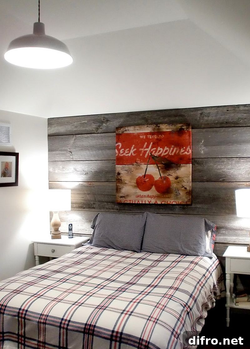 Farmhouse style bedroom with a modest reclaimed wood feature wall [Design: barnboardstore]